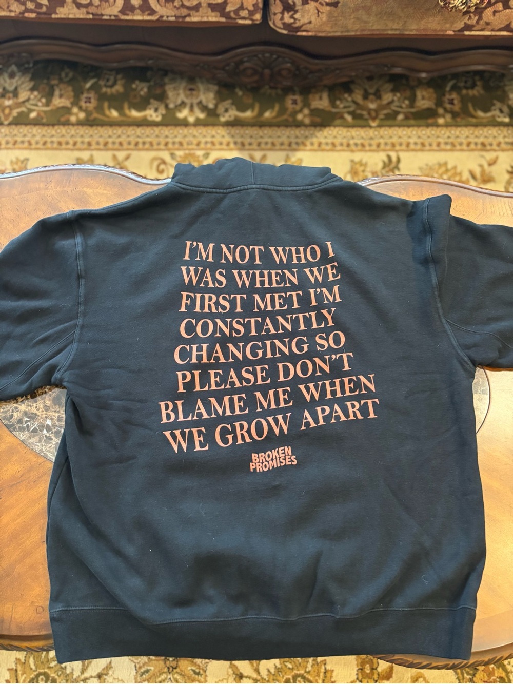Broken Promises black hoodie with featuring a vintage-style graphic Size XL